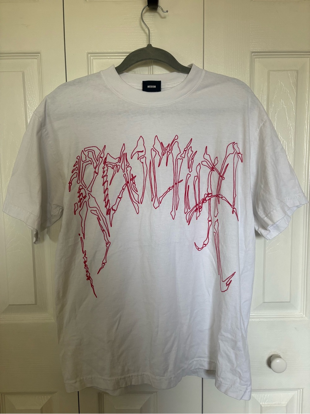 Revenge Bones White Graphic T-Shirt with Red Script Design